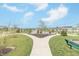 Scenic community park featuring lush landscaping, walking paths, a tranquil pond, and inviting green spaces for relaxation and recreation at 192 Lynnette Way, Cumberland, IN 46229
