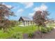 Charming community gazebo surrounded by lush trees, plantings and inviting playground at 192 Lynnette Way, Cumberland, IN 46229