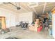Spacious garage with concrete floor, white door, and ample storage space at 192 Lynnette Way, Cumberland, IN 46229