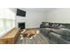 Cozy living room with a fireplace, large sofa, and stylish decor for relaxation at 192 Lynnette Way, Cumberland, IN 46229