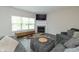 Cozy living room features a fireplace, TV, and comfortable gray sectional sofa at 192 Lynnette Way, Cumberland, IN 46229