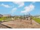Community playground with swings, slides, and gazebo, surrounded by lush green grass at 192 Lynnette Way, Cumberland, IN 46229