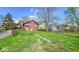 View of the backyard and the houses behind it at 21 N Bosart Ave, Indianapolis, IN 46201