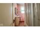 Small pink tile bathroom with combined shower and tub at 21 N Bosart Ave, Indianapolis, IN 46201