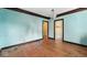 Dining room with bare floors and walls at 21 N Bosart Ave, Indianapolis, IN 46201