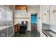 Efficient kitchen with basic appliances, vintage details, and tile backsplash at 21 N Bosart Ave, Indianapolis, IN 46201