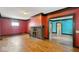 Living room with hardwood floors and brick fireplace at 21 N Bosart Ave, Indianapolis, IN 46201