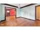 Living room with hardwood flooring, baseboard trim and picture frame molding at 21 N Bosart Ave, Indianapolis, IN 46201