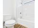 Bathroom with a white toilet and a white shower-tub combination with silver shower head at 2327 Mimosa Ln, Anderson, IN 46011