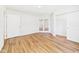 Bright bedroom features hardwood floors, a closet, and french doors to another room at 2327 Mimosa Ln, Anderson, IN 46011