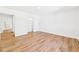 Well-lit bedroom featuring wood-look flooring and closet with sliding doors at 2327 Mimosa Ln, Anderson, IN 46011