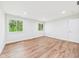 An empty room with hardwood floors and bright light, ready for the new homeowner at 2327 Mimosa Ln, Anderson, IN 46011