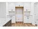Bright kitchen featuring ample white cabinetry with granite countertops and stainless hardware at 2327 Mimosa Ln, Anderson, IN 46011