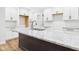 Kitchen with island, granite counters, stainless faucet, and white shaker style cabinets at 2327 Mimosa Ln, Anderson, IN 46011
