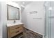 Modern bathroom with stylish vanity, sleek mirror, and glass-enclosed shower for spa-like experience at 2402 N B St, Elwood, IN 46036