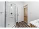 Contemporary bathroom featuring a glass enclosed shower, complemented by modern fixtures for a fresh, clean aesthetic at 2402 N B St, Elwood, IN 46036