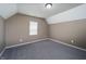 Bright bedroom features plush carpet, neutral walls, white trim, and lots of natural light at 2402 N B St, Elwood, IN 46036