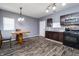 Bright kitchen with dark cabinetry, stainless steel appliances, and a modern dining area, ready for cooking and entertaining at 2402 N B St, Elwood, IN 46036