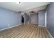 Open-concept living space with stairs, modern flooring, and neutral walls, ideal for comfortable everyday living at 2402 N B St, Elwood, IN 46036