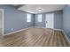 Spacious living room featuring sleek flooring, a neutral color palette, and ample natural light for a welcoming ambiance at 2402 N B St, Elwood, IN 46036