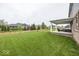 Expansive backyard featuring a covered patio and wood fence at 2432 Scarlet Oak Dr, Avon, IN 46123