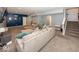 Spacious finished basement featuring sectional sofa, stairs and adjacent room at 2432 Scarlet Oak Dr, Avon, IN 46123