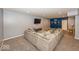 Basement with comfortable sectional sofa, mounted TV and adjacent accent wall at 2432 Scarlet Oak Dr, Avon, IN 46123