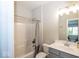 Well-lit bathroom with a shower and tub combo and gray vanity at 2432 Scarlet Oak Dr, Avon, IN 46123