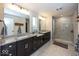 Bathroom featuring double vanity with granite countertop and tiled shower at 2432 Scarlet Oak Dr, Avon, IN 46123
