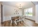 Bright dining room featuring white wainscoting and a rustic wood table with seating for six at 2432 Scarlet Oak Dr, Avon, IN 46123