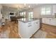 Bright kitchen with granite countertops and stainless steel appliances open to the dining and living area at 2432 Scarlet Oak Dr, Avon, IN 46123