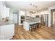 Modern kitchen featuring stainless steel appliances, a center island with seating, and white cabinetry at 2432 Scarlet Oak Dr, Avon, IN 46123