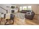 Spacious living room featuring a cozy fireplace, large windows, and hardwood floors at 2432 Scarlet Oak Dr, Avon, IN 46123