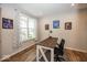 Home office featuring a wooden desk, neutral walls, and natural light from a window at 2432 Scarlet Oak Dr, Avon, IN 46123