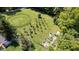 An aerial view of the horse property featuring a round pen, fruit trees, and garden at 2450 S Us 421, Zionsville, IN 46077