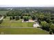 Sprawling equestrian estate showcasing pastures, riding arena, trees, and home at 2450 S Us 421, Zionsville, IN 46077