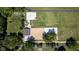Aerial view of horse farm with a fenced arena, barn, and green pastures at 2450 S Us 421, Zionsville, IN 46077