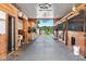 Spacious barn interior featuring stalls, storage, and an open view to the outside at 2450 S Us 421, Zionsville, IN 46077