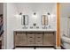 Bright bathroom with white plank walls, dual vanities with modern fixtures, and wood accents at 2450 S Us 421, Zionsville, IN 46077