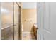 En suite bathroom features a walk-in shower, vanity with storage, and a neutral color palette at 2450 S Us 421, Zionsville, IN 46077