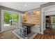 Dining area features custom wood accents and a sliding glass door leading to the deck at 2450 S Us 421, Zionsville, IN 46077