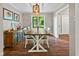 Bright dining room features a decorative light fixture, a window view to the outdoors, and a sideboard at 2450 S Us 421, Zionsville, IN 46077