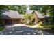 Traditional home with brick facade, two-car garage, and mature landscaping at 2450 S Us 421, Zionsville, IN 46077