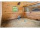 A clean and spacious horse stall featuring a window, hay, and blue toys at 2450 S Us 421, Zionsville, IN 46077
