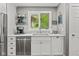 This bright kitchen features stainless steel appliances and a view of the backyard at 2450 S Us 421, Zionsville, IN 46077