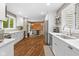 The kitchen flows into the dining area, featuring stainless appliances and wooden accents at 2450 S Us 421, Zionsville, IN 46077
