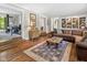 Living room featuring hardwood floors, built-in shelving, and classic decor at 2450 S Us 421, Zionsville, IN 46077