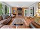 Inviting living room with fireplace, hardwood floors, and lots of natural light at 2450 S Us 421, Zionsville, IN 46077