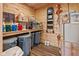 A well-organized storage room with wood paneled walls, shelving, and equipment at 2450 S Us 421, Zionsville, IN 46077