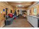 A beautifully finished tack room featuring wood paneled walls, storage benches, and functional cabinetry at 2450 S Us 421, Zionsville, IN 46077